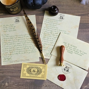 May include: A collection of parchment-style stationery including an acceptance letter, a list of required books, a train ticket to Platform 9 3/4, and an envelope with a red wax seal. A brown feather quill and a wooden wax seal stamp are included.