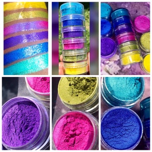 May include: A set of six small jars filled with colorful pigments. The jars are stacked in a tower, with the yellow pigment on the bottom and the blue pigment on the top. The pigments are vibrant and shimmery, and they would be perfect for adding a touch of color to any project.