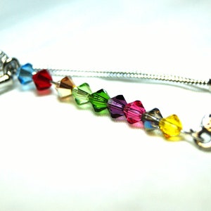 Charm orden de sorteo con jeringuilla hep y tirita 4mm Swarovski