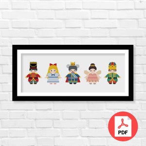 May include: A framed cross-stitch pattern featuring five characters from the Nutcracker ballet. The characters are a soldier, a girl in a blue dress, a mouse king, a fairy, and a second soldier. The characters are all in a row and are facing forward.