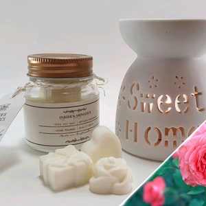May include: Aromatherapy set with a white ceramic oil burner, cut-out text reading "Sweet Home", and a glass jar candle with a gold lid. Also includes wax melts and a tag reading "French Lavender".
