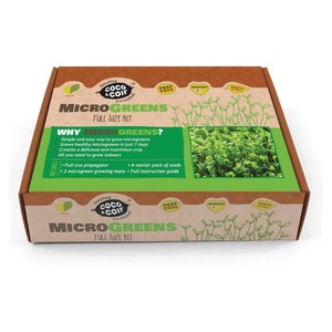May include: A brown cardboard box with a green and white label that says "Microgreens Full Size Kit". The label also includes the text "Everything in a nutshell Coco Coir" and "Why Microgreens?" with a list of bullet points. The box is sitting on a white background.