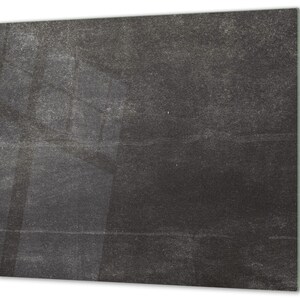 May include: A dark grey textured background with a subtle pattern of light grey lines.