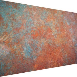 May include: A close-up of a rusty metal surface with a mottled pattern of orange, brown, and blue. The surface has a rough, textured appearance.