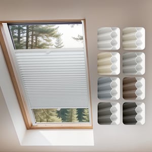 Puede incluir: Una persiana celular blanca instalada en una ventana de techo. El marco de la ventana es de madera. Se muestra una paleta de colores de tonos a la derecha, incluyendo opciones blancas, beige, grises y marrones.