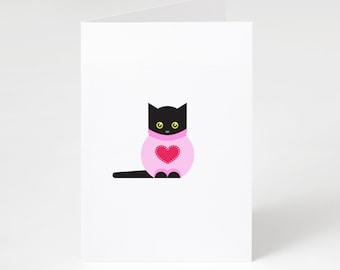 Puede incluir: Tarjeta de felicitación blanca plegada con un gato negro de dibujos animados que lleva un suéter rosa con un corazón rojo. El gato tiene ojos amarillos y está sentado erguido. La tarjeta está en blanco por dentro.