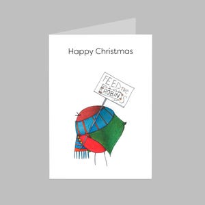 May include: A festive Christmas card with a watercolour illustration of a robin. The robin is wearing a blue and green scarf and holding a sign that says "Feed the Robins." The card also has the text "Happy Christmas".