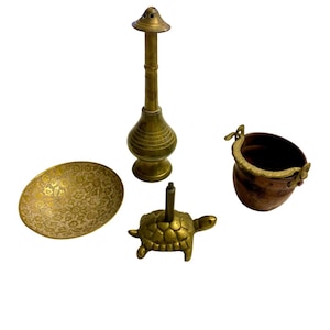 May include: A set of four brass and copper decorative items. The set includes a small incense burner shaped like a turtle, a small bowl with an intricate floral design, a small copper bucket with a brass handle, and a tall brass incense burner with a round base and a small spout.