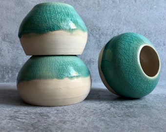 Trio of stackable green ceramic jars with crackle enamel