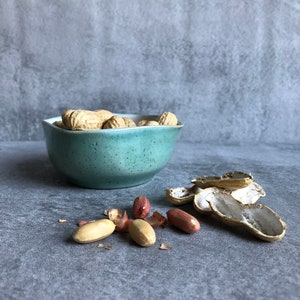 Small turquoise and white ceramic bowl