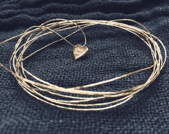 Maxi semainier with elastic gold or silver thread