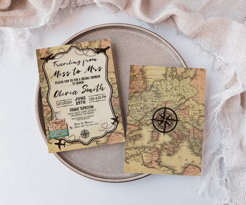 May include: Two vintage-style bridal shower invitations with a map design. One invitation features the text "Traveling from Miss to Mrs" and event details. The other shows a compass rose. The invitations are on a gray plate.