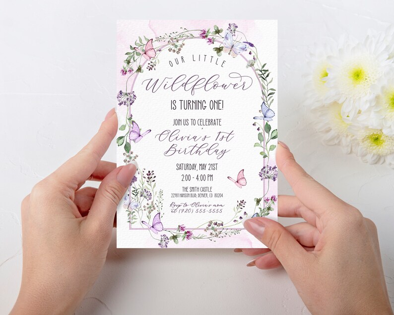 May include: A pink and purple floral birthday invitation with butterflies and the text "Our Little Wildflower is Turning One! Join us to celebrate Olivia's 1st Birthday Saturday, May 21st 2:00 - 4:00 PM The Smith Castle 22181 SOSUR, DEVER, CO 80204 RSVP to Olivia's (720) 555-5555"