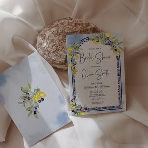 May include: Bridal shower invitation and matching envelope featuring watercolor illustrations of lemons, olives, and foliage. The invitation includes the text "Join us for a Bridal Shower to honor Olivia Smith" and event details.