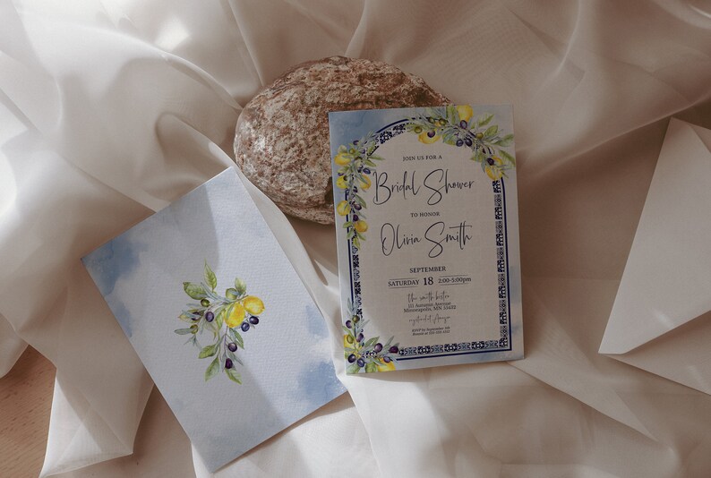 May include: Bridal shower invitation and matching envelope featuring watercolor illustrations of lemons, olives, and foliage. The invitation includes the text "Join us for a Bridal Shower to honor Olivia Smith" and event details.