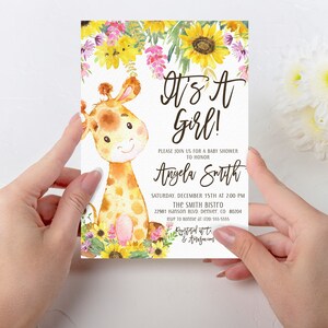 May include: A baby shower invitation with a cute cartoon giraffe illustration. The invitation is decorated with sunflowers and other flowers. The text on the invitation reads "It's a Girl!" and includes the name "Angela Smith", the date and time of the shower, and the location.