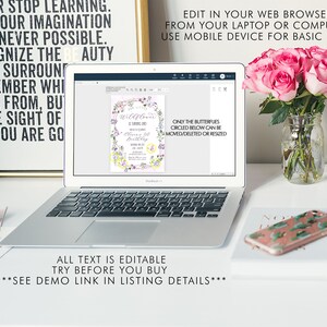 May include: A laptop screen displaying a printable invitation with a floral design and the text "Wildflower is turning one!" and "Oliver's 1st Birthday". The text "Only the butterflies circled below can be moved/deleted or resized" is also visible on the screen. The laptop is on a white desk with a vase of pink roses and a phone with a cactus design.