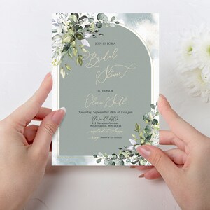 May include: A green and white floral bridal shower invitation with a gold arch and the text "Join us for a Bridal Shower to honor Olivia Smith" and details for the event.