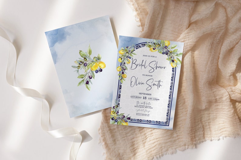 May include: Two watercolor invitations with a bridal shower theme. One features a lemon and olive branch design on a light blue background. The other invitation has the text "Join us for a Bridal Shower to Honor Olivia Smith".