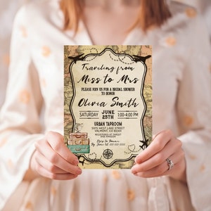 May include: A vintage-style invitation for a bridal shower, held on June 25th. The design features a world map background, decorative frame, and illustrations of suitcases and airplanes. The invitation reads "Traveling from Miss to Mrs" and includes event details.