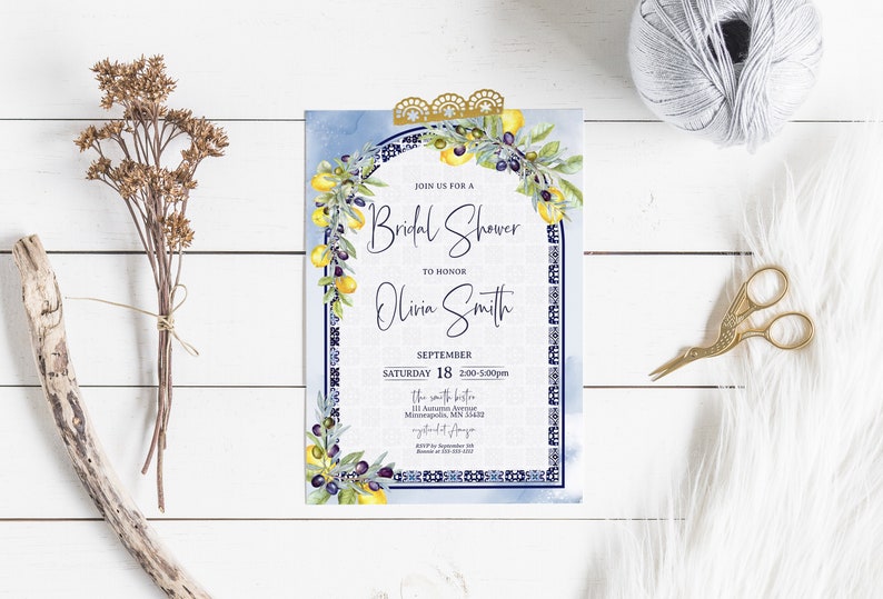 May include: A bridal shower invitation with a watercolor blue background and a decorative border. The invitation features a floral design with lemons and olives, and the text "Join us for a Bridal Shower to Honor Olivia Smith".