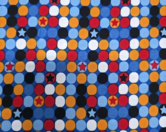 Raro tejido de jersey orgánico de 95 cm con lunares y estrellas.