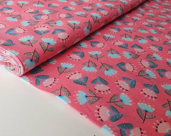 May include: Pink fabric with a repeating pattern of blue and pink flowers with brown stems.