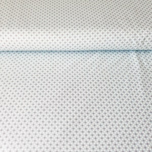 Könnte beinhalten: Ein Nahaufnahme eines hellblauen Stoffes mit einem weißen und grauen Tupfenmuster.