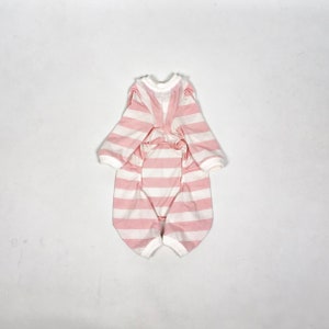 The flatlay of the Pink & White Striped onesie shows white cuffs on the hems and a frill around the neckline.