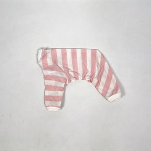 The flatlay of the Pink & White Striped onesie shows white cuffs on the hems and a frill around the neckline.
