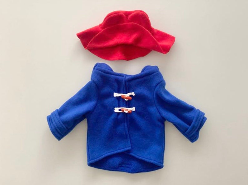 Paddington Bear Outfit with a blue overcoat complete with white wooden toggles and a large oversized red hat just like Paddington.