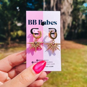 Gold Starburst Hoop Earrings: Celestial Huggies with Cubic Zirconia