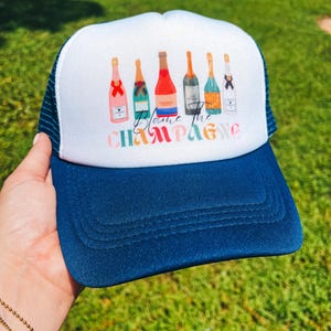 Navy &quot;Blame It On The Champagne&quot; Trucker Hat: Colorful Party Cap