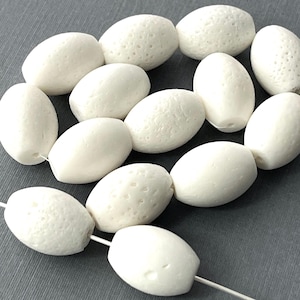 Natural White Coral Olive Bead 17mm, 14pcs. Elegant Gemstone in Soft White, Perfect for Unique Jewelry Creations.