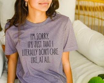 May include: A purple t-shirt with the text "I'M SORRY, IT'S JUST THAT I LITERALLY DON'T CARE. LIKE, AT ALL."