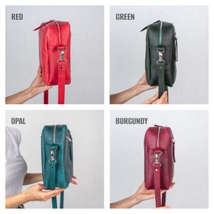 May include: Four leather crossbody bags in red, green, opal, and burgundy. Each bag has a rectangular shape, a top zipper, and a long, adjustable strap. The bags are displayed against a neutral background, with the color names in the top left corner of each image.