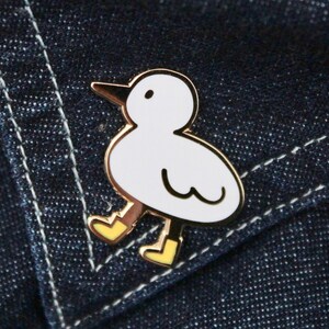 bird with boots enamel pin image 4