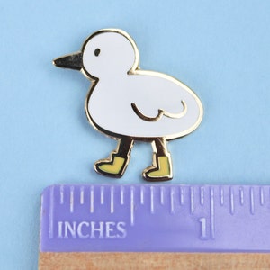 bird with boots enamel pin image 3