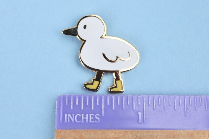 bird with boots enamel pin image 3