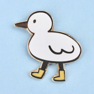 bird with boots enamel pin image 2