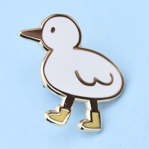 bird with boots enamel pin image 1