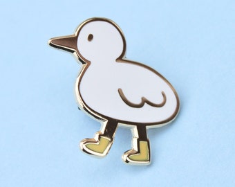 bird with boots enamel pin