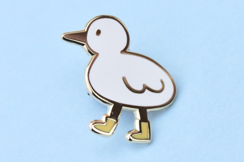 bird with boots enamel pin image 1