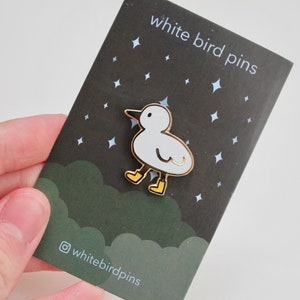 bird with boots enamel pin image 5