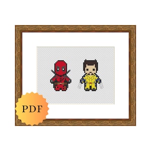 May include: A framed cross-stitch pattern featuring a pixelated image of Deadpool and Wolverine. The pattern is in a brown frame with a white mount.