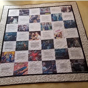 May include: A white and black quilt with a checkered pattern. Each square features a different photograph of people. The quilt has a black border and a white border with a wavy pattern.