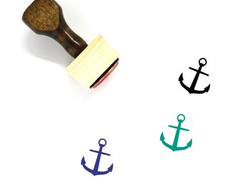 May include: Wooden stamp with a black anchor design. The stamp is mounted on a wooden handle. Three anchor designs are shown in black, blue, and green.