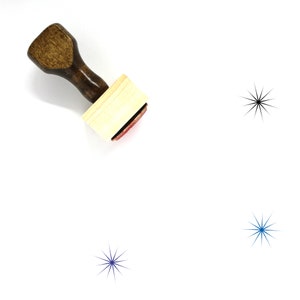 May include: A wooden stamp with a brown handle and a rectangular wooden block with a red ink pad. The stamp is on a white surface with three black and blue starbursts.