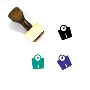 Puede incluir: Un sello de goma de madera con un icono de escala negro, verde y azul. El sello se utiliza para crear un icono de escala en papel.
