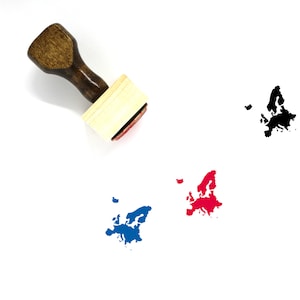 May include: A wooden stamp with a handle and a rectangular base. The base has a design of the map of Europe in black ink. There are three impressions of the stamp on a white surface: one in black, one in blue, and one in red.